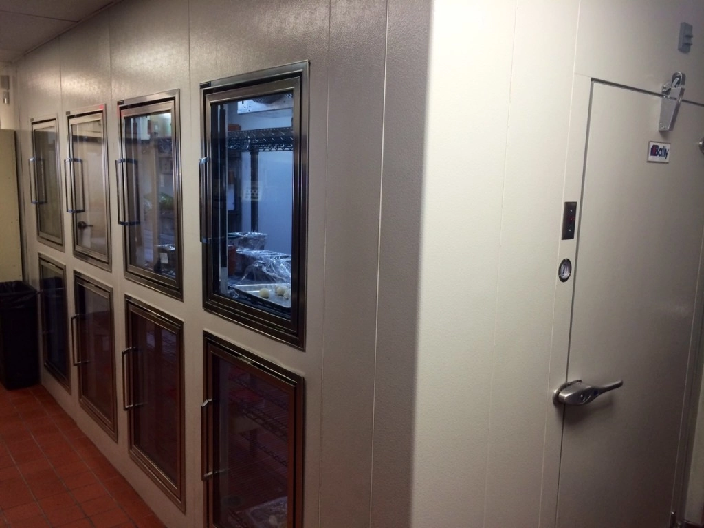 A Bally walk-in cooler with glass doors, installed by Dine Company.